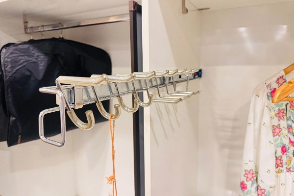 Wardrobe accessories for organized storage and efficient space including handles and sleek fittings.